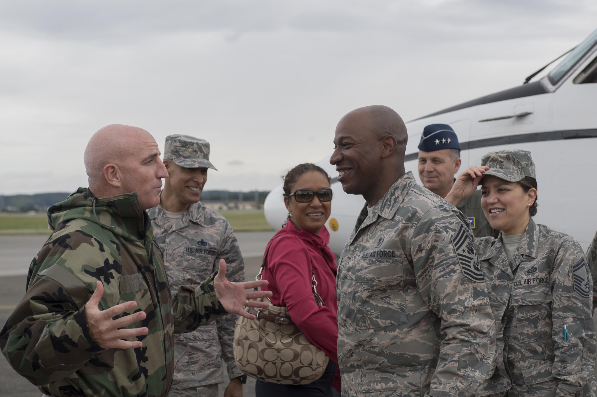 Col. Kenneth Moss, 374th Airlift Wing commander, welcomes Chief Master Sgt. of the Air Force Kaleth O. Wright and his wife, Tonya, June 8, 2017, at Yokota Air Base, Japan. Wright has been visiting Pacific Air Forces bases to interact with Airmen and get their feedback. 