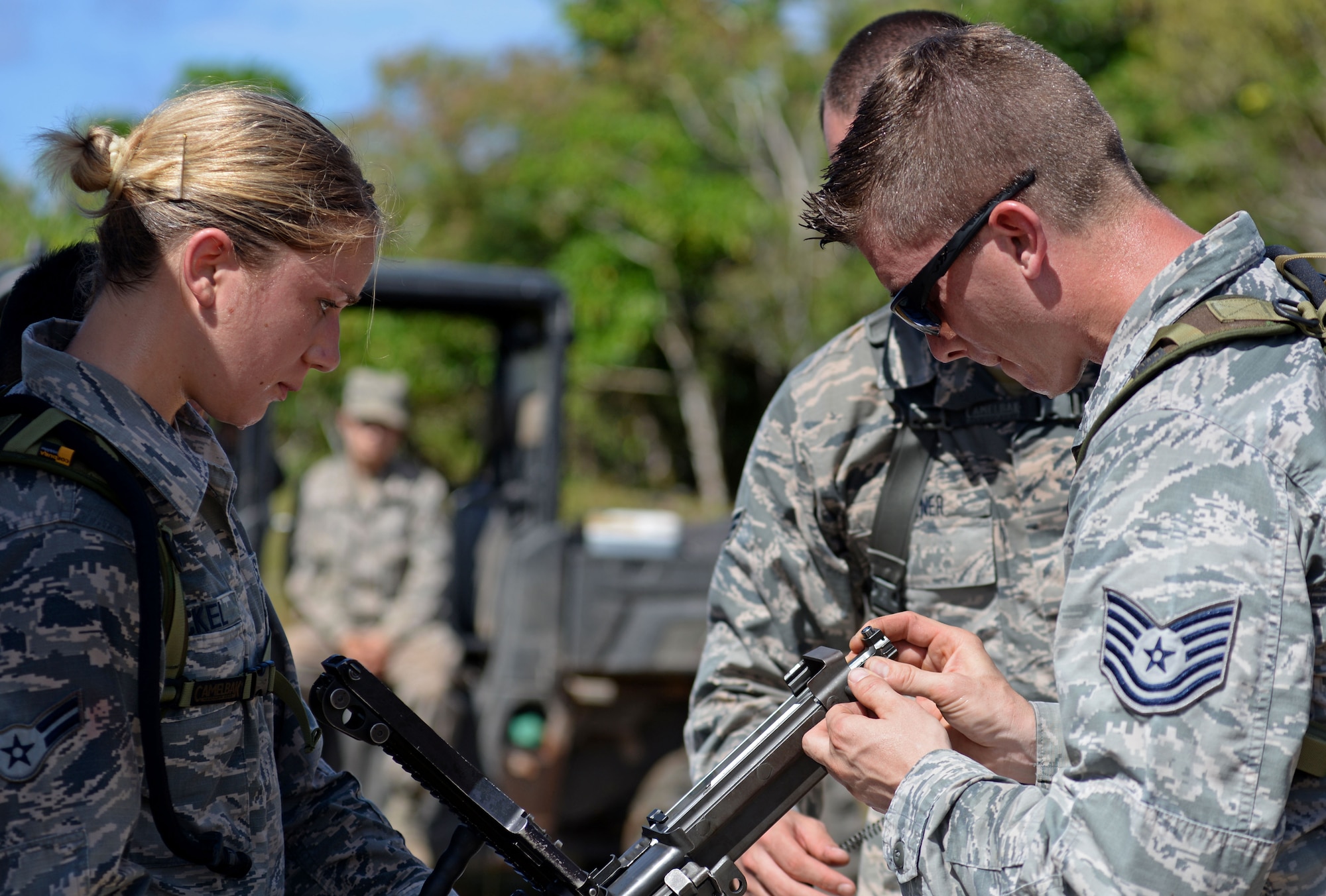 U.S. Airmen with the 35th Security Forces Squadron, Misawa Air Base, Japan, assemble an M240 machine gun during the second annual Security Forces Combat Skills Assessment June 6, 2017 at Andersen Air Force Base, Guam. The mental and physical challenge portion tested basic combat skills and knowledge of competitors at different stations along an obstacle course through the jungle. (U.S. Air Force photo by Airman 1st Class Gerald R. Willis) 