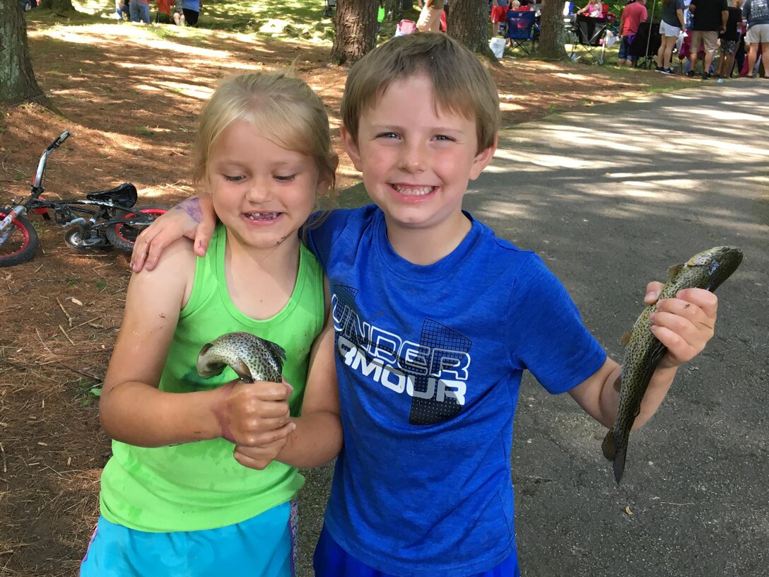 Several kids hold the trout they caught during the 20th Annual Kids Fishing Rodeo June 10, 2017 at the Dale Hollow National Fish Hatchery.