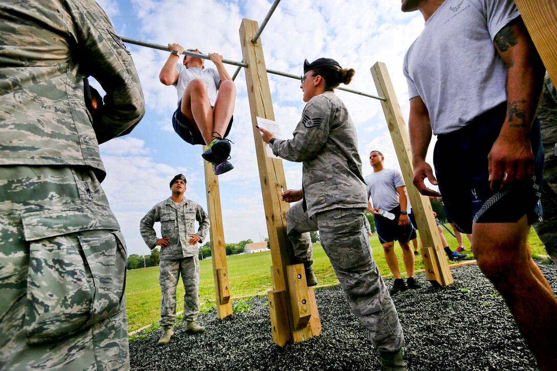 New Jersey Air National Guardsmen participate in the flex-arm hang during a test for the German Armed Forces Badge for Military Proficiency at Joint Base McGuire-Dix-Lakehurst, N.J., June 13, 2017. Air National Guard photo by Master Sgt. Matt Hecht