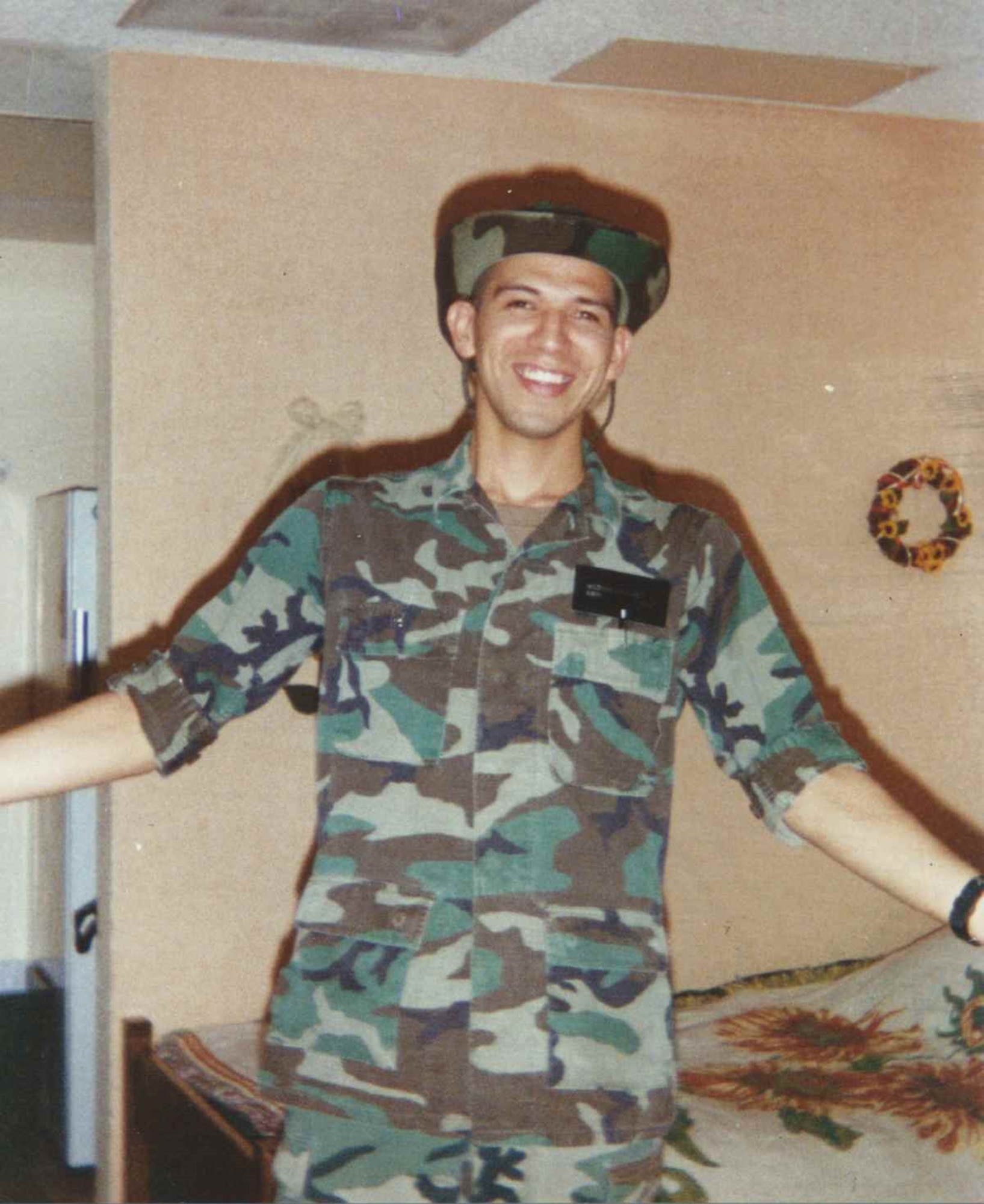 U.S. Air Force Airman 1st Class Adrian Medina Sanchez poses for a photograph at Nellis Air Force Base, Nevada in 1996. Medina Sanchez will be retiring from the Air Force after twenty four years of service which he never thought would turn into a career. (Courtesy by Master Sgt. Adrian Medina Sanchez)