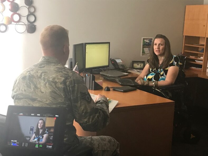 Jana Wormuth, 88th Air Base Wing plans and programs program manager, interacts with SSgt Andy Huntamer, 88th Air Base Wing Safety occupational safety technician, as they are filmed for the PACE’s “Teamwork” Heritage Today video on June 6, 2017. The video will feature Air Force civilians and their contributions to the Air Force mission. (U.S. Air Force photo/Stacey Geiger)