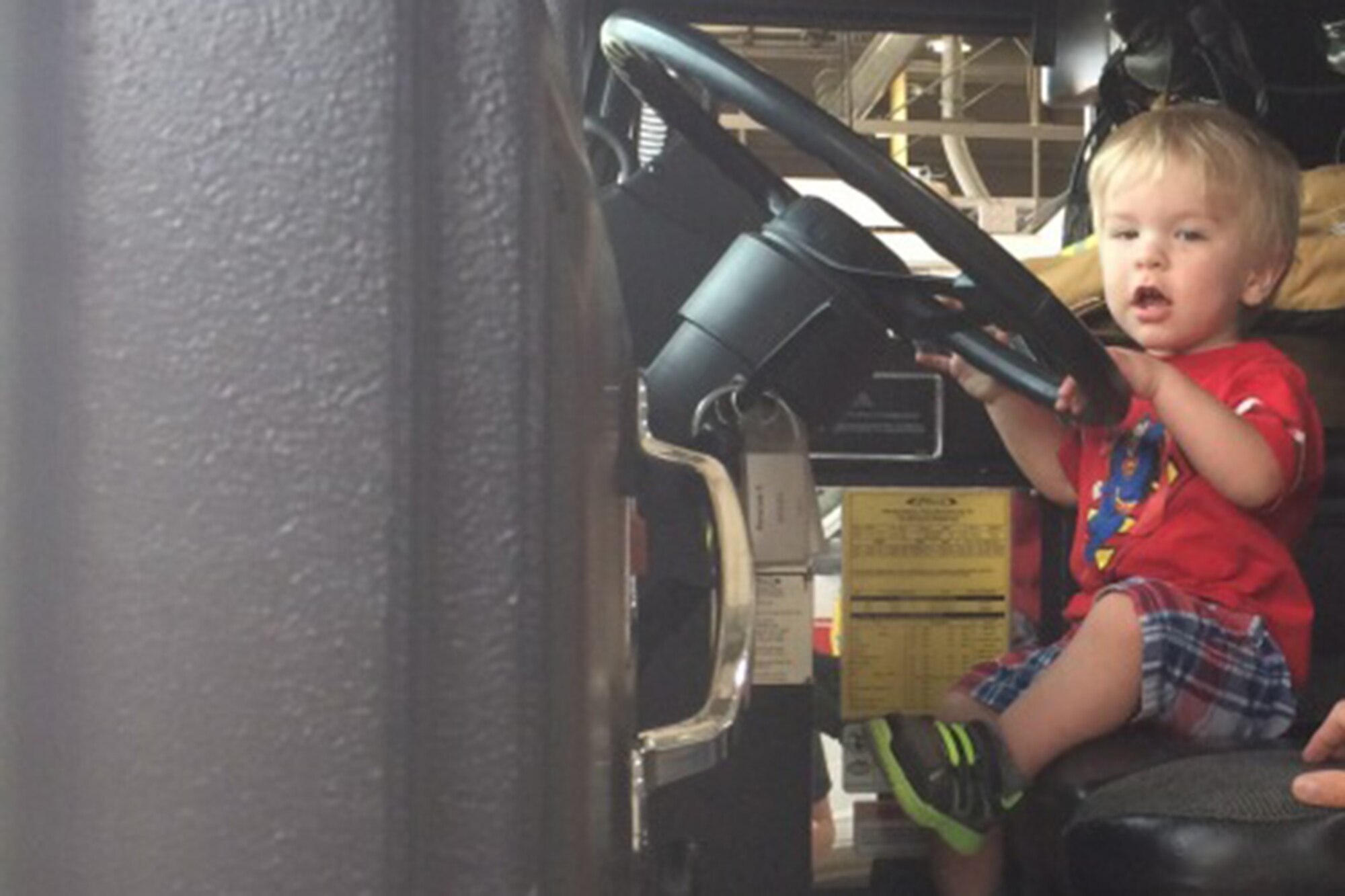 Waylon Shupperd, 2, gets a closer look at the inside of a fire engine during a visit to Grissom, May 23. Grissom first responders helped save his life recently and his family visited the fire department to say thank you. (Courtesy photo)
