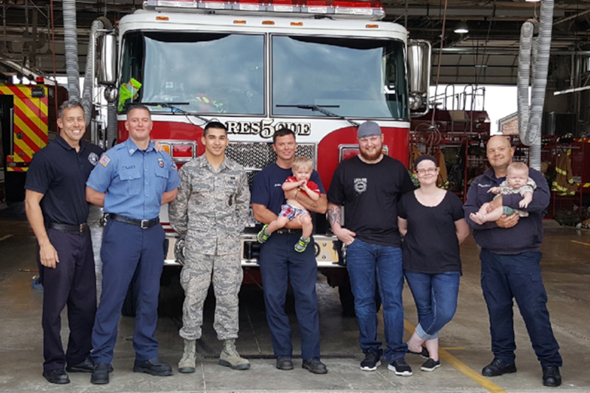 The Shupperd family visited Grissom fire station to thank the team for saving their son’s life, May 23. Listed from left to right: Jay Salmons, Tom Carey, Airman 1st Class Andrew Smith, Robert Jacobs holding Waylon Shupperd, Brandon Shupperd, Megan Shupperd and David Perryman holding their youngest son Maverick Shupperd. (Courtesy photo)