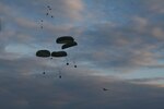 Members of the Minnesota National Guard and the Lithuanian Army work with elements of the U.S. Air Force to coordinate airborne supply drops of meal rations via a C-130 Hercules Aircraft for Exercise Saber Strike 17 in Pabrade, Lithuania, June 9, 2017.
