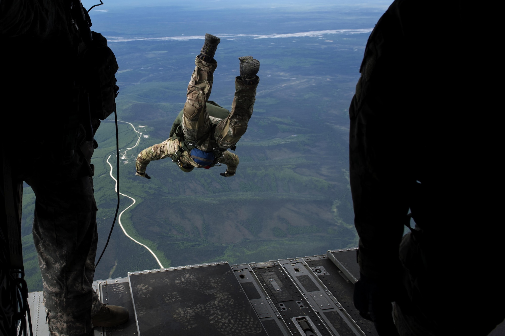 A tactical air control party member from the 116th Air Support Special Operations Squadron, jumps out of a CH-47 Chinook for a training mission during Red Flag-Alaska 17-2, June 7, 2017, at Eielson Air Force Base, Alaska. Red Flag-Alaska provides an optimal training environment in the Indo-Asia Pacific Region and focuses on improving ground, space, and cyberspace combat readiness and interoperability of U.S. and international forces. (U.S. Air Force photo/Staff Sgt. Paul Labbe)