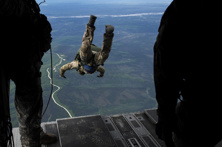 A tactical air control party member from the 116th Air Support Special Operations Squadron, jumps out of a CH-47 Chinook for a training mission during Red Flag-Alaska 17-2, June 7, 2017, at Eielson Air Force Base, Alaska. Red Flag-Alaska provides an optimal training environment in the Indo-Asia Pacific Region and focuses on improving ground, space, and cyberspace combat readiness and interoperability of U.S. and international forces. (U.S. Air Force photo/Staff Sgt. Paul Labbe)