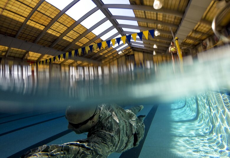 Tech. Sgt. David Troche from the New Jersey Air National Guard's 108th Security Forces Squadron swims the 100 meter challenge during a German Armed Forces Badge for Military Proficiency test at Joint Base McGuire-Dix-Lakehurst, N.J., June 13, 2017. The test included a 1x10-meter sprint, flex arm hang, 1,000 meter run, 100 meter swim in military uniform, marksmanship, and a timed foot march. (U.S. Air National Guard photo/Master Sgt. Matt Hecht)