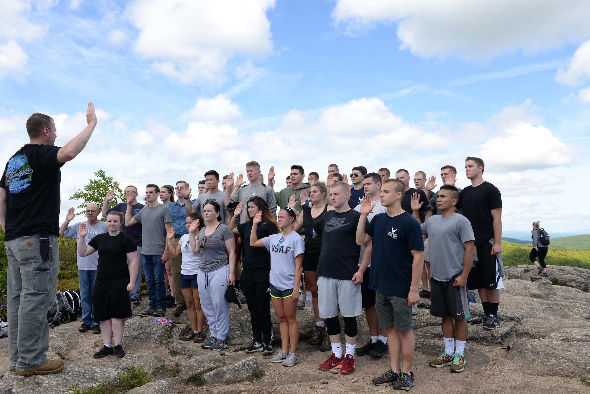 Members of the 157th Air Refueling Wing Student Flight and the 157th ARW recruiting team, are reenlisted ontop of Mount Major in Alton, N.H. June 4, 2017. Captain Joseph A. Smith III reenlisted members ontop of the mountain to mark the beginning of a newly improved student flight program. (United States Air National Guard Photo By Victoria Nelson)