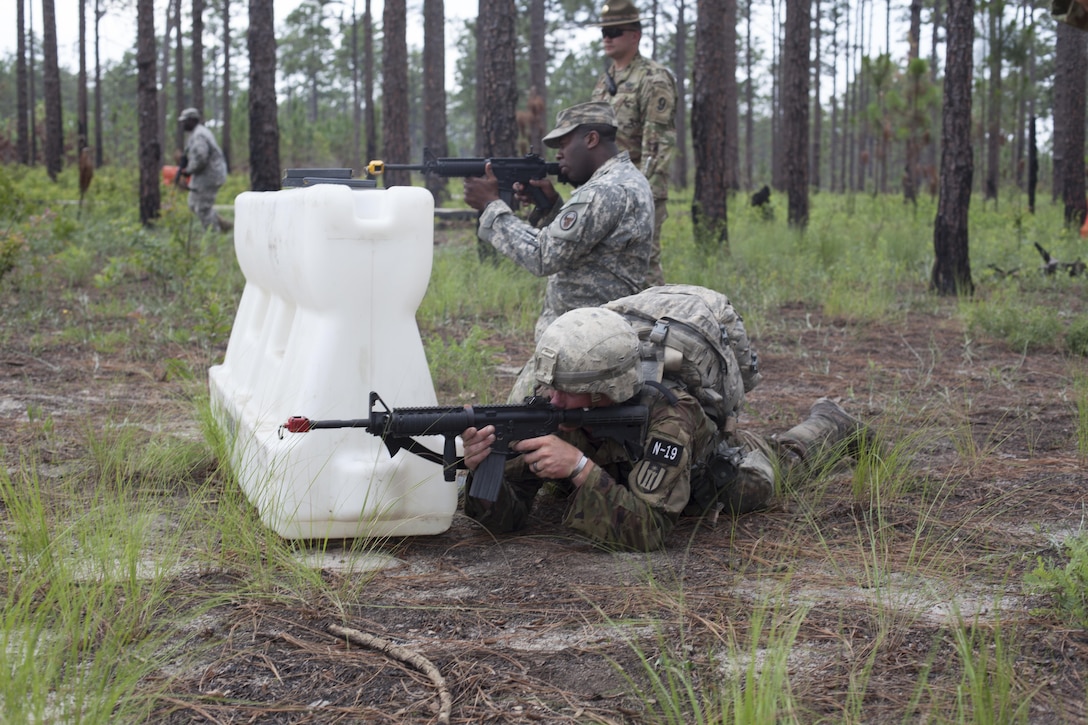 Warriors engage simulated enemy fire during a mystery event at the 2017 U.S. Army Reserve Best Warrior Competition at Fort Bragg, N.C. June 15. This year's Best Warrior Competition will determine the top noncommissioned officer and junior enlisted Soldier who will represent the U.S. Army Reserve in the Department of the Army Best Warrior Competition later this year at Fort A.P. Vill, Va. (U.S. Army Reserve photo by Spc. Jesse L. Artis Jr.) (Released)