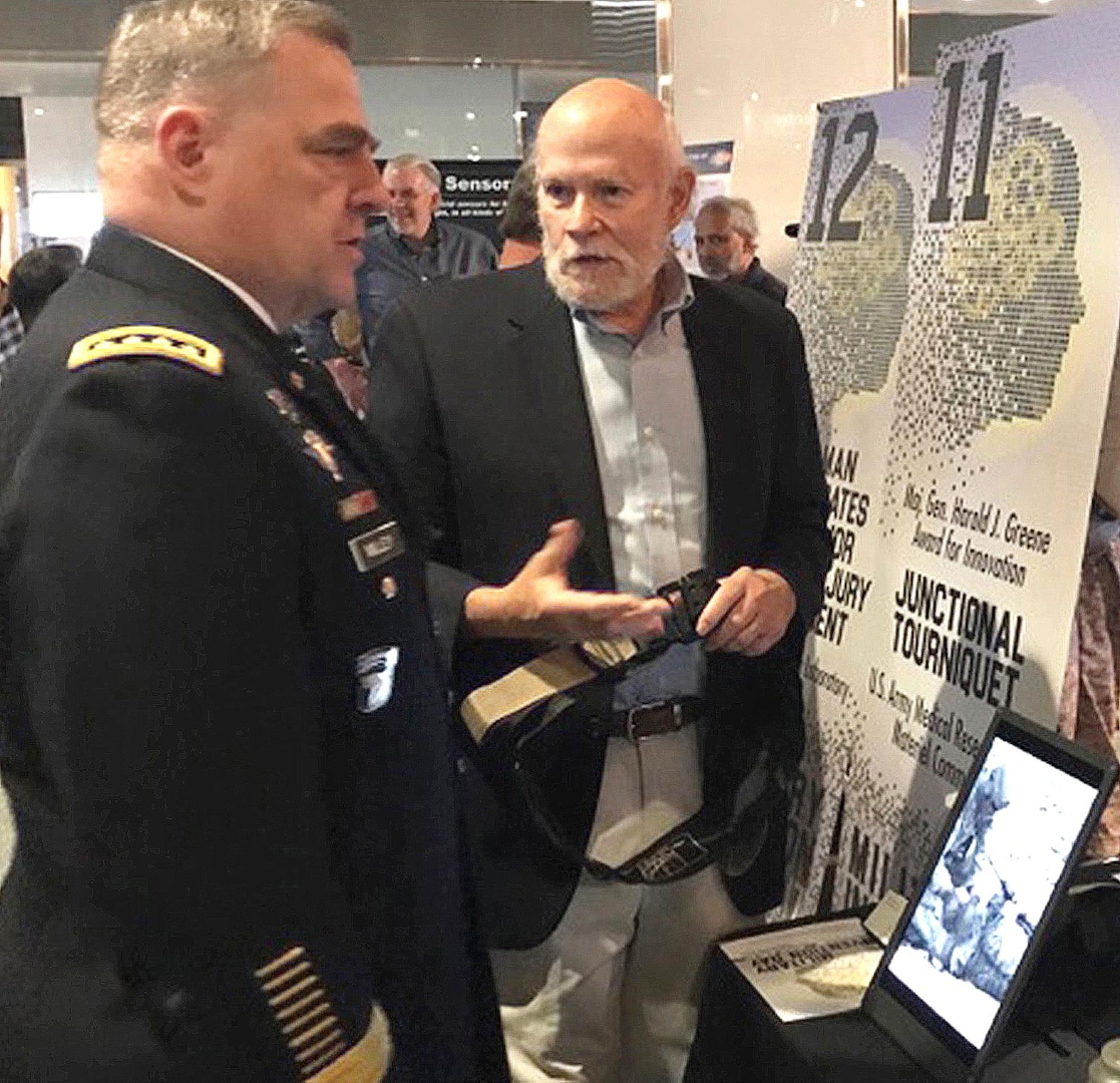 Michael A. Dubick, Ph.D., chief of the U.S. Army Institute of Surgical Research Damage Control Resuscitation Research Program at Joint Base San Antonio-Fort Sam Houston, explains the function and capabilities the SAM Junctional Tourniquet to Gen. Mark A. Milley, Army Chief of Staff.