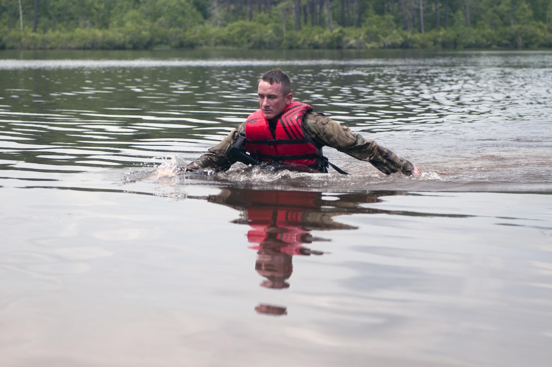 Sgt. 1st Class Andrew England, a combat engineer specialist representing the 416th Theater Engineer Command, finishes up his 300-meter swim during the mystery event Day 4 at the 2017 U.S. Army Reserve Best Warrior Competition at Fort Bragg, N.C. June 15. This year’s Best Warrior Competition will determine the top noncommissioned officer and junior enlisted Soldier who will represent the U.S. Army Reserve in the Department of the Army Best Warrior Competition later this year at Fort A.P. Hill, Va. (U.S. Army Reserve photo by Spc. Noel Williams) (Released)