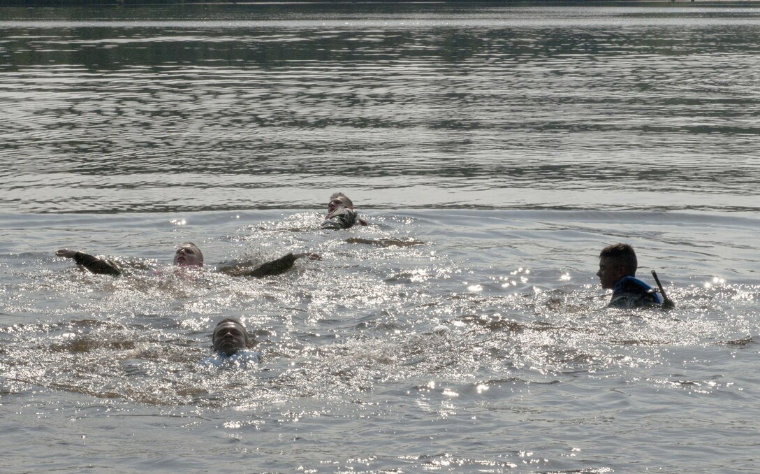 Warriors swim across a 300-meter lake during a culminating series of "mystery events" at the 2017 U.S. Army Reserve Best Warrior Competition at Fort Bragg, N.C. June 15. This year’s Best Warrior Competition will determine the top noncommissioned officer and junior enlisted Soldier who will represent the U.S. Army Reserve in the Department of the Army Best Warrior Competition later this year at Fort A.P. Hill, Va. (U.S. Army Reserve photo by SGT David Turner) (Released)