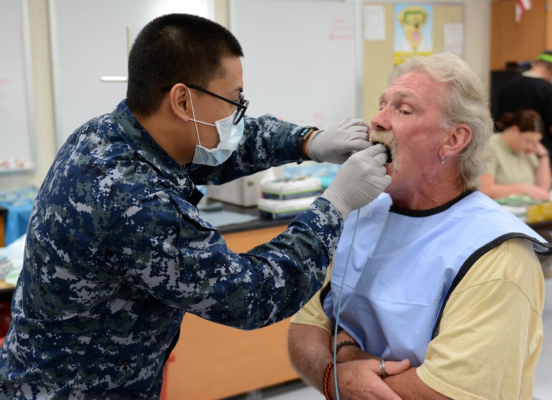 Navy Petty Officer 3rd Class Ernest Manzon, a dental assistant from the Expeditionary Medical Force of Camp Pendleton, Calif., takes x-rays of a patient during Innovative Readiness Training at Mountain Home, Ark., June 12, 2017. The IRT program allows active-duty, guard and reserve members to volunteer for real-world training opportunities through engineering, veterinarian, medical, and construction projects that benefit the sometimes-forgotten citizens of American communities in need. (U.S. Air National Guard photo by Staff Sgt. Carlynne DeVine)