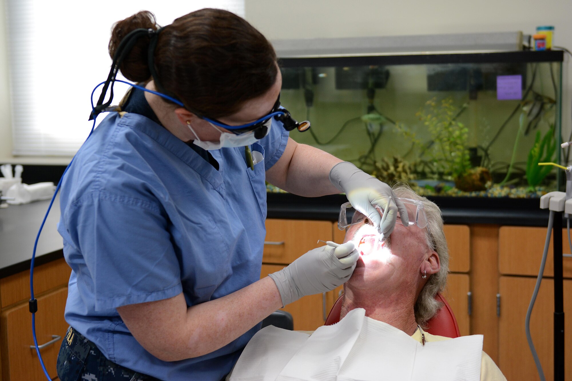 Navy Lt. Juliana Fila, a dentist from Naval Hospital Bremerton, Wash., cleans a patient’s teeth during Innovative Readiness Training at Mountain Home, Ark., June 12, 2017. The IRT program allows active-duty, guard and reserve members to volunteer for real-world training opportunities through engineering, veterinarian, medical, and construction projects that benefit the sometimes-forgotten citizens of American communities in need. (U.S. Air National Guard photo by Staff Sgt. Carlynne DeVine)