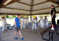 Team ‘F-16 SPO’ tries for the fastest time during a ‘turn out’ competition where each team member simulates a fire alarm and must dress in firefighter clothing and equipment as quickly as possible. Teams of Airmen from across the base took part in an annual fire muster, which was held at Centennial Park on Hill Air Force Base, June 14, 2017. (Todd Cromar/U.S. Air Force)