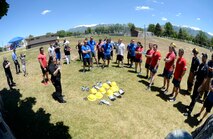 Fire Inspector/Public Educator Tiana Bykowski, 775th Civil Engineer Squadron, explains a competition to competitors during an annual fire muster held at Centennial Park, Hill Air Force Base, June 14, 2017. (Todd Cromar/U.S. Air Force)