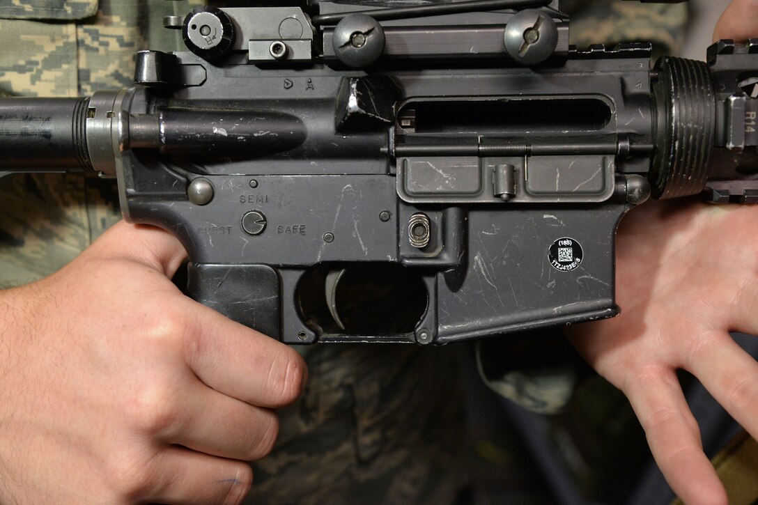 Senior Airman Tyler Merrill, 341st Security Forces Support Squadron armorer, shows an empty chamber June 9, 2017, at Malmstrom Air Force Base, Mont. Firearms should be unloaded when not in use. (U.S. Air Force photo/Airman 1st Class Daniel Brosam)