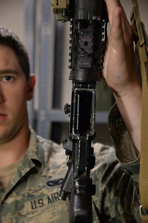 Senior Airman Tyler Merrill, 341st Security Forces Support Squadron armorer, demonstrates an unloaded weapon June 9, 2017, at Malmstrom Air Force Base, Mont. Whenever a weapon is picked up, always point it in a safe direction and make sure it is unloaded. (U.S. Air Force photo/Airman 1st Class Daniel Brosam)