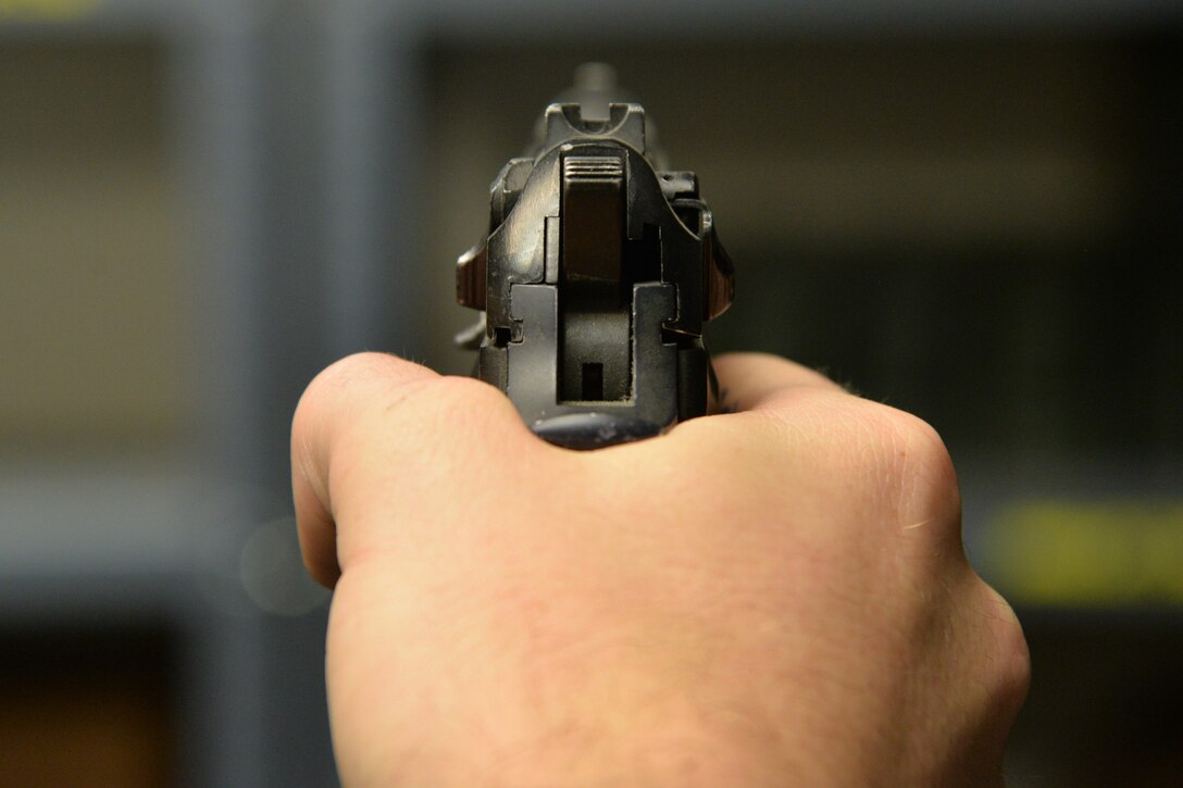 Senior Airman Tyler Merrill, 341st Security Forces Support Squadron armorer, holds a firearm June 14, 2017, at Malmstrom Air Force Base, Mont. Storage or introduction of firearms in dormitories and billeting is prohibited. (U.S. Air Force photo/Airman 1st Class Daniel Brosam)