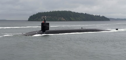 The Ohio-class ballistic-missile submarine USS Kentucky (SSBN 737) transits the Hood Canal June 15, 2017 as it returns to its homeport following a strategic deterrent patrol. Kentucky is one of eight ballistic-missile submarines stationed at Naval Base Kitsap-Bangor, providing the most survivable leg of the strategic deterrence triad for the U.S.