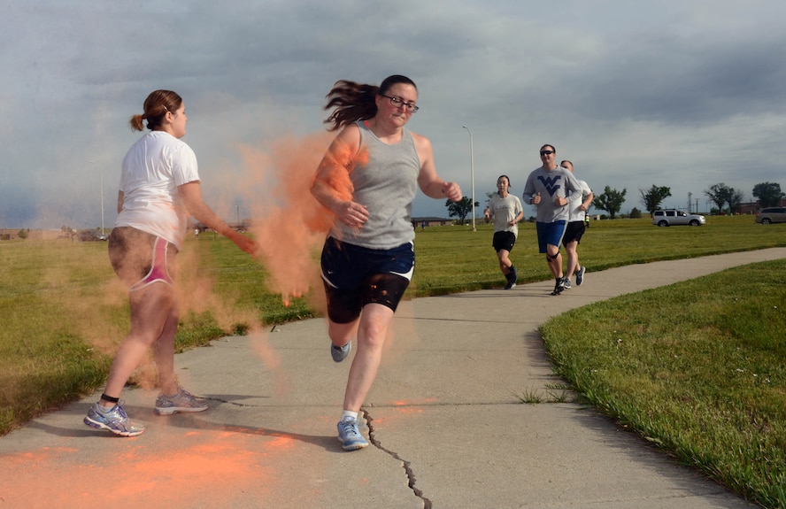 An Airman gets painted in the Second Annual LGBT Pride Month Color Run at Ellsworth Air Force Base, S.D., June 16, 2017. The first Color Run was founded in March 2011 as an event to promote healthiness and happiness by bringing the community together. (U.S. Air Force photo by Airman 1st Class Donald C. Knechtel)