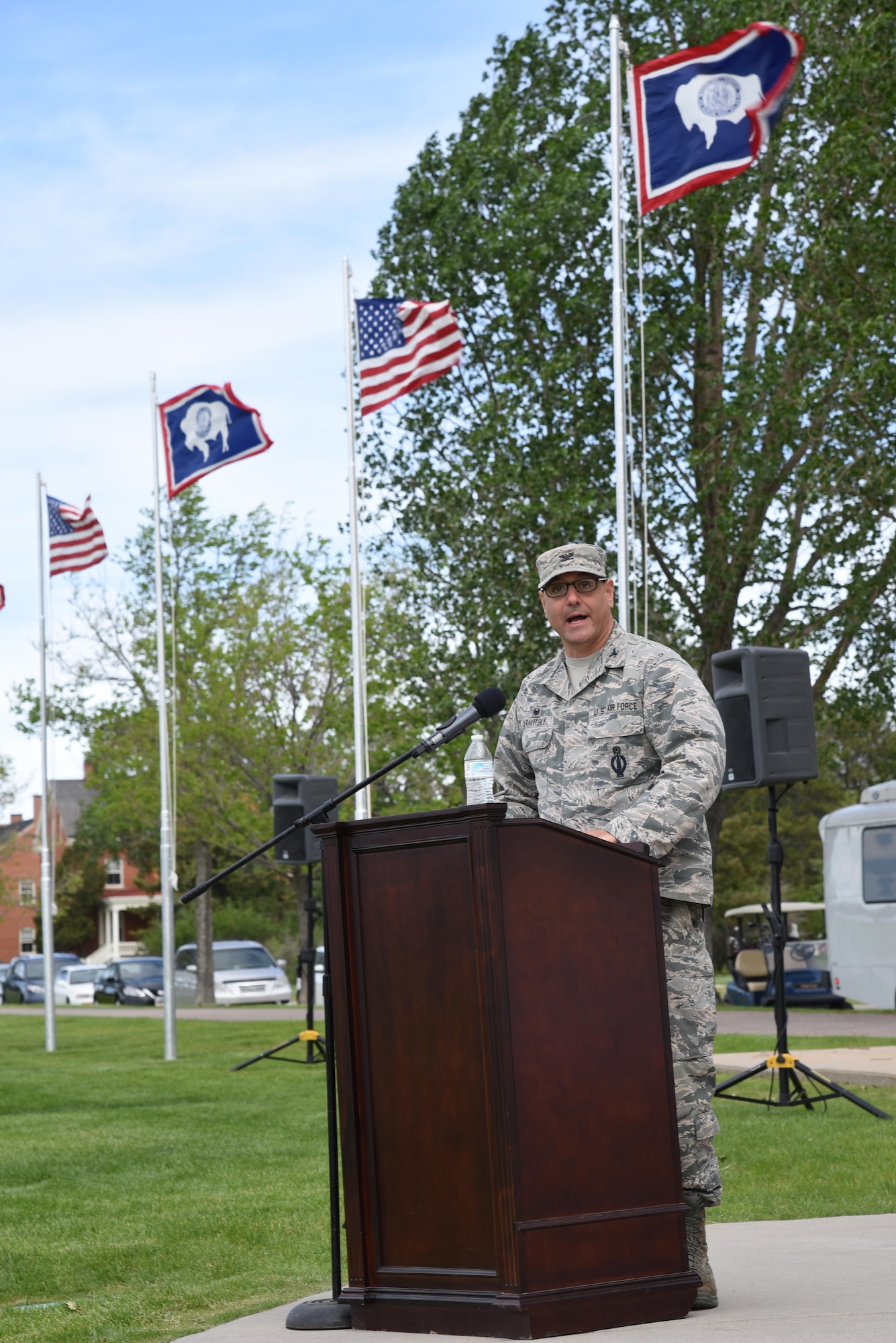 Colonel Stephen Kravitsky, 90th Missile Wing commander, speaks at the 90th Mission Support Group Change of Command on the Argonne Parade Field at F.E. Warren Air Force Base, Wyo., June 16, 2017. Kravitsky spoke about Col. Frank Verdugo's achievements in his tenure at the 90th MSG, as well as why Col. Tricia Van Den Top is the right fit to succeed Verdugo and assume command of the group. (U.S. Air Force photo by Glenn S. Robertson)