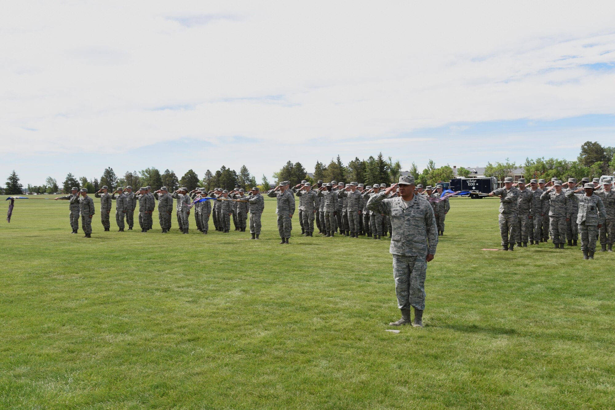 Airmen in the 90th Mission Support Group render a final salute to Col. Frank Verdugo, their outgoing commander, at the 90th MSG Change of Command on the Argonne Parade Field at F.E. Warren Air Force Base, Wyo., June 16, 2017. Col. Tricia Van Den Top assumed command of the group during the ceremony which represents a formal transition of authority from the outgoing commander to the incoming commander. (U.S. Air Force photo by Glenn S. Robertson)