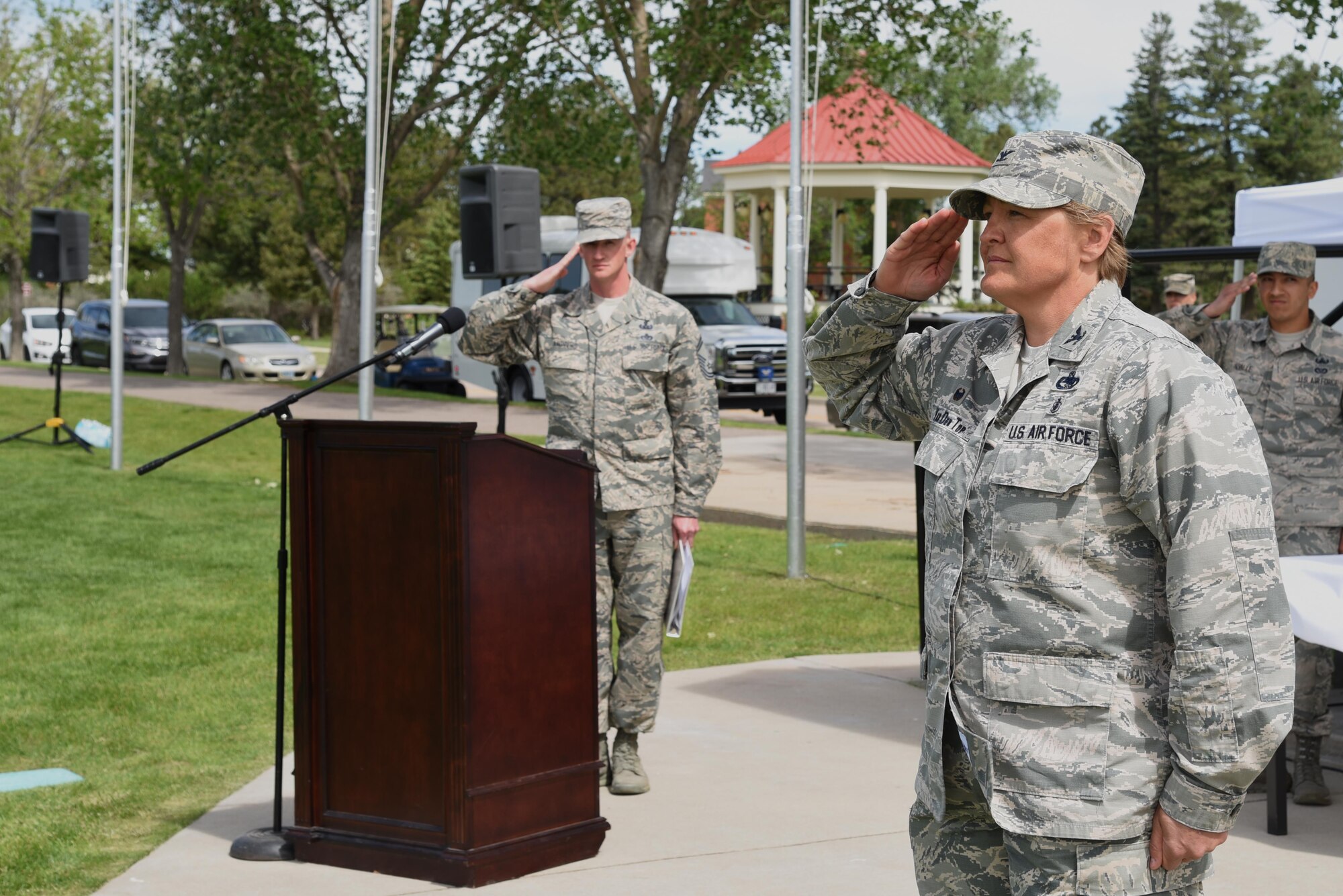 Colonel Tricia Van Den Top renders her first salute as commander to her troops at the 90th MSG Change of Command on the Argonne Parade Field at F.E. Warren Air Force Base, Wyo., June 16, 2017. Van Den Top assumed command of the group during the ceremony which represents a formal transition of authority from the outgoing commanding to the incoming commander. (U.S. Air Force photo by Glenn S. Robertson)