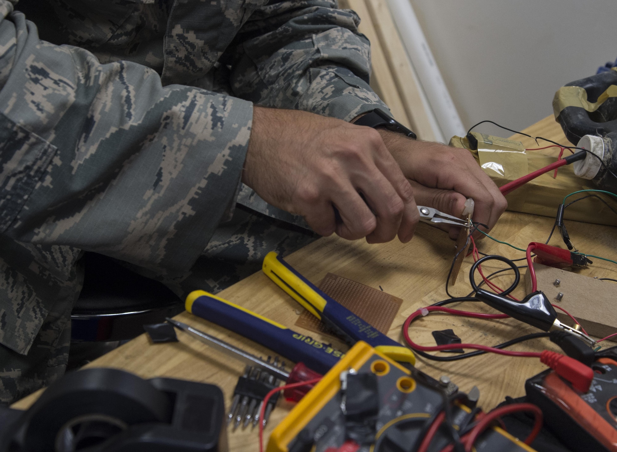 Tech. Sgt. Lucas Mefford, 11th Civil Engineer explosive ordinance disposal craftsman, builds training aids for upcoming missions at Joint Base Andrews, Md., June 6, 2017. Mefford attended an inpatient program at the National Intrepid Center of Excellence program, in Bethesda, Md., for depression, insomnia, and other symptoms. He continues his medical treatment at JBA and hopes to influence his Airmen to be advocates for their health. (U.S. Air Force photo by Senior Airman Mariah Haddenham)