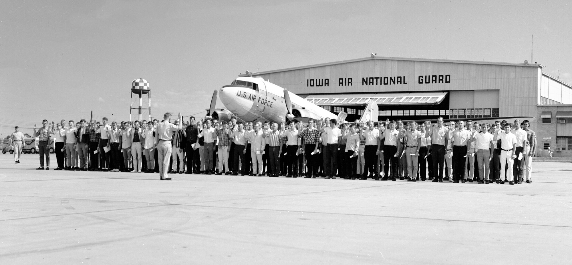 Maj. LeRoy A. Wagner, 185th Tactical Fighter Group, Sioux City, Iowa is shown swearing in 146 new Air Guardsmen at the Sioux City Air Base, on 28 August 1965. (U.S. Air National Guard photo by SSgt. Duane McCullum/Released)