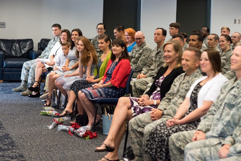 Airmen, family and guests look on as Col. Dane Crawford (not pictured) speaks during the 18th Air Support Operations Group  change-of-command ceremony here. Crawford took command of the group June 7. 