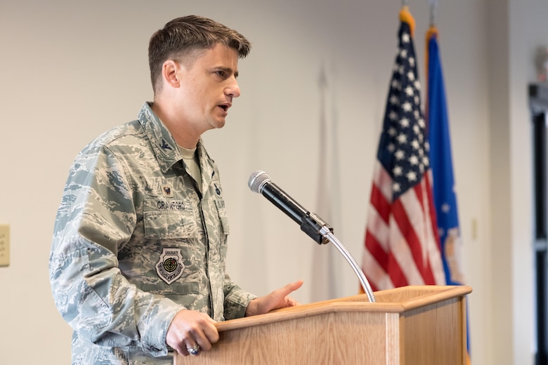 Col. Dane Crawford speaks to members of the 18th Air Support Operations Group and guests after taking command of the group during a ceremony at the Airmen's Center here June 7. 