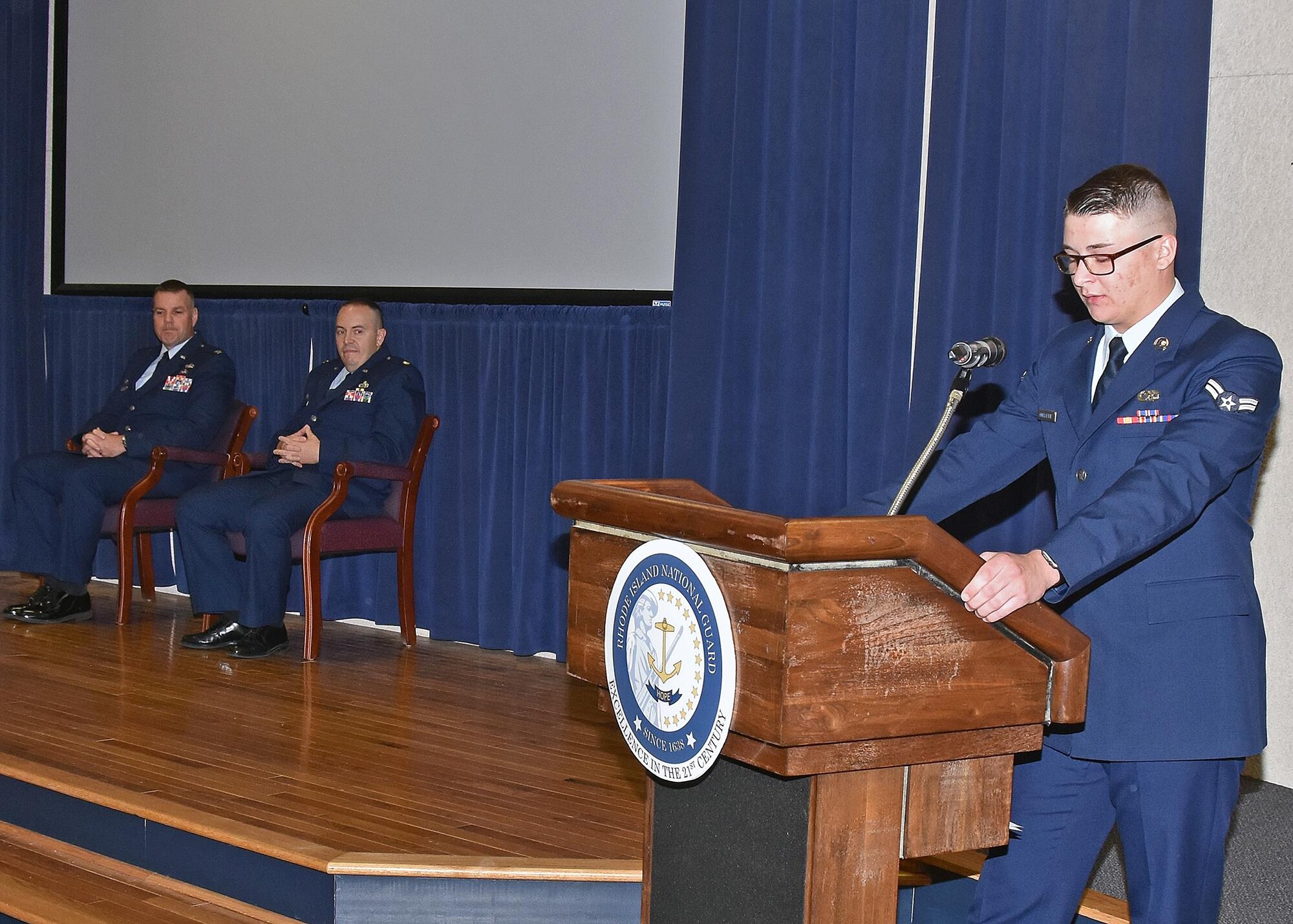 Major Edward Ouellette Junior assumes command of the 143d Force Support Squadron during a ceremony held at Quonset Air National Guard Base, North Kingstown, Rhode Island. Major Ouellette's father, retired Lieutenant Colonel Edward Ouellette Senior is the former commander of the Force Support Squadron. Airman First Class Dylan Ouellette, 143d Maintenance Squadron, Major Ouellette's son, serves as the master of ceremonies for the event. 