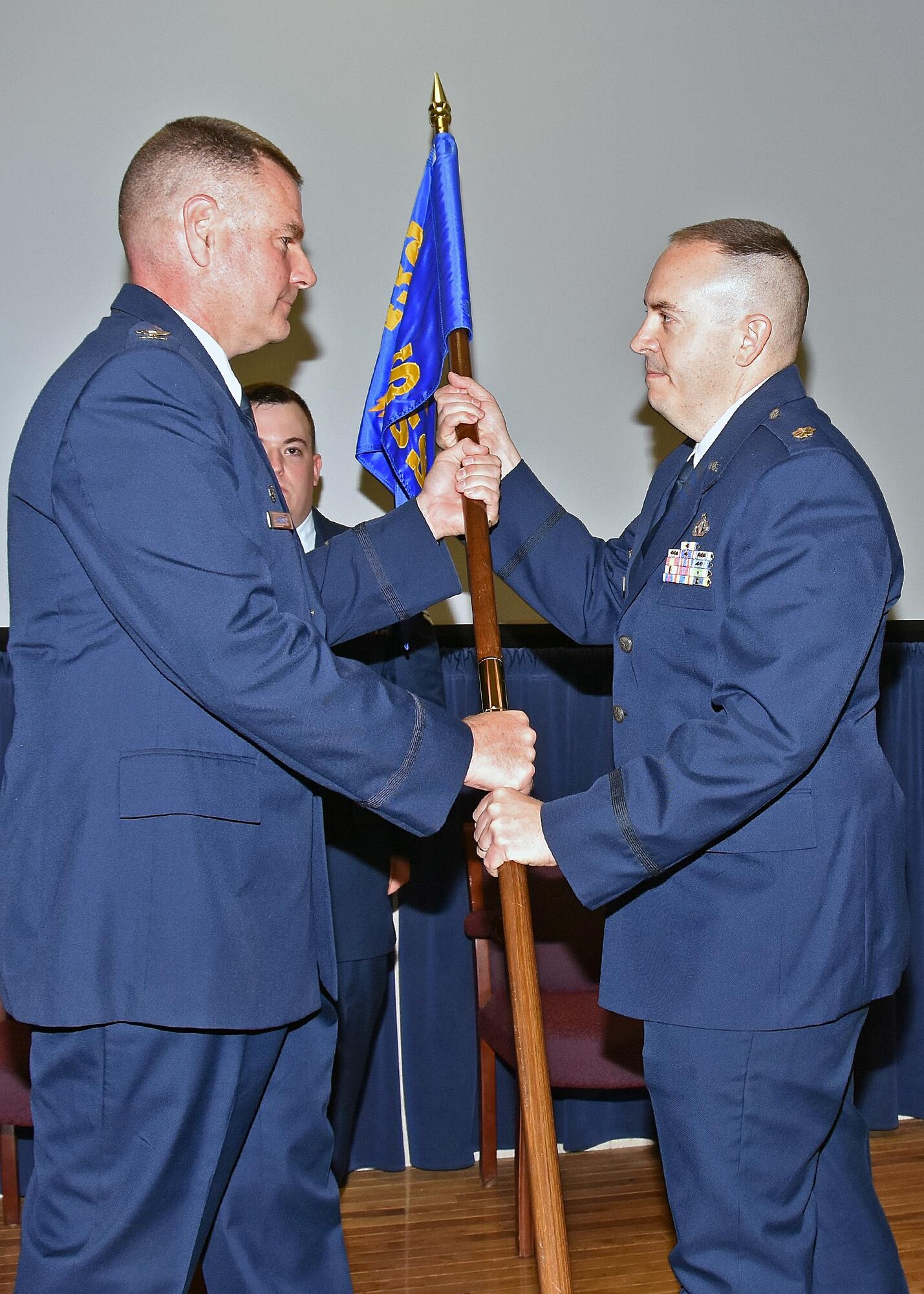 Major Edward Ouellette Junior assumes command of the 143d Force Support Squadron during a ceremony held at Quonset Air National Guard Base, North Kingstown, Rhode Island. Major Ouellette's father, retired Lieutenant Colonel Edward Ouellette Senior is the former commander of the Force Support Squadron. Airman First Class Dylan Ouellette, 143d Maintenance Squadron, Major Ouellette's son, serves as the master of ceremonies for the event. 