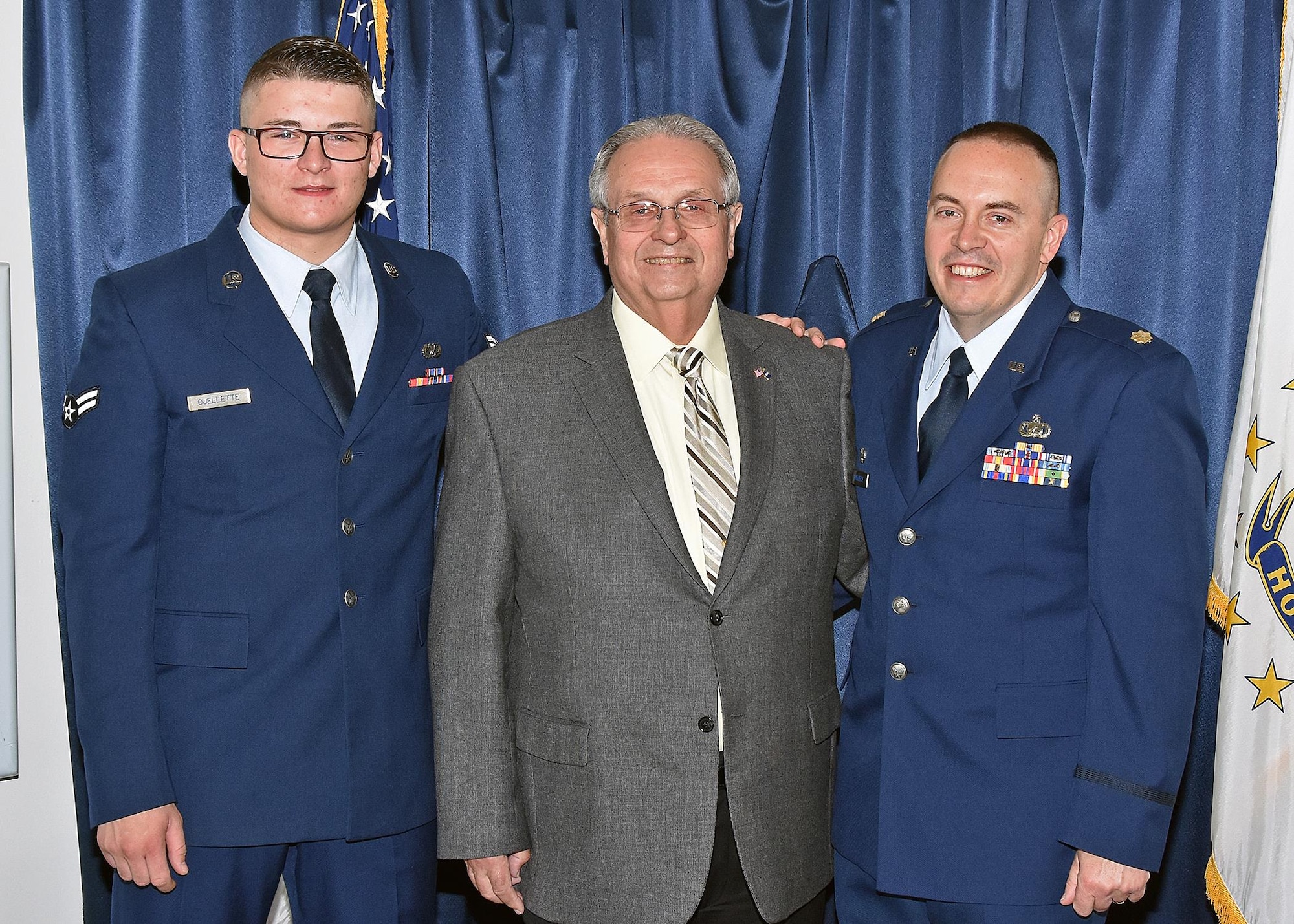 Major Edward Ouellette Junior assumes command of the 143d Force Support Squadron during a ceremony held at Quonset Air National Guard Base, North Kingstown, Rhode Island. Major Ouellette's father, retired Lieutenant Colonel Edward Ouellette Senior is the former commander of the Force Support Squadron. Airman First Class Dylan Ouellette, 143d Maintenance Squadron, Major Ouellette's son, serves as the master of ceremonies for the event. 