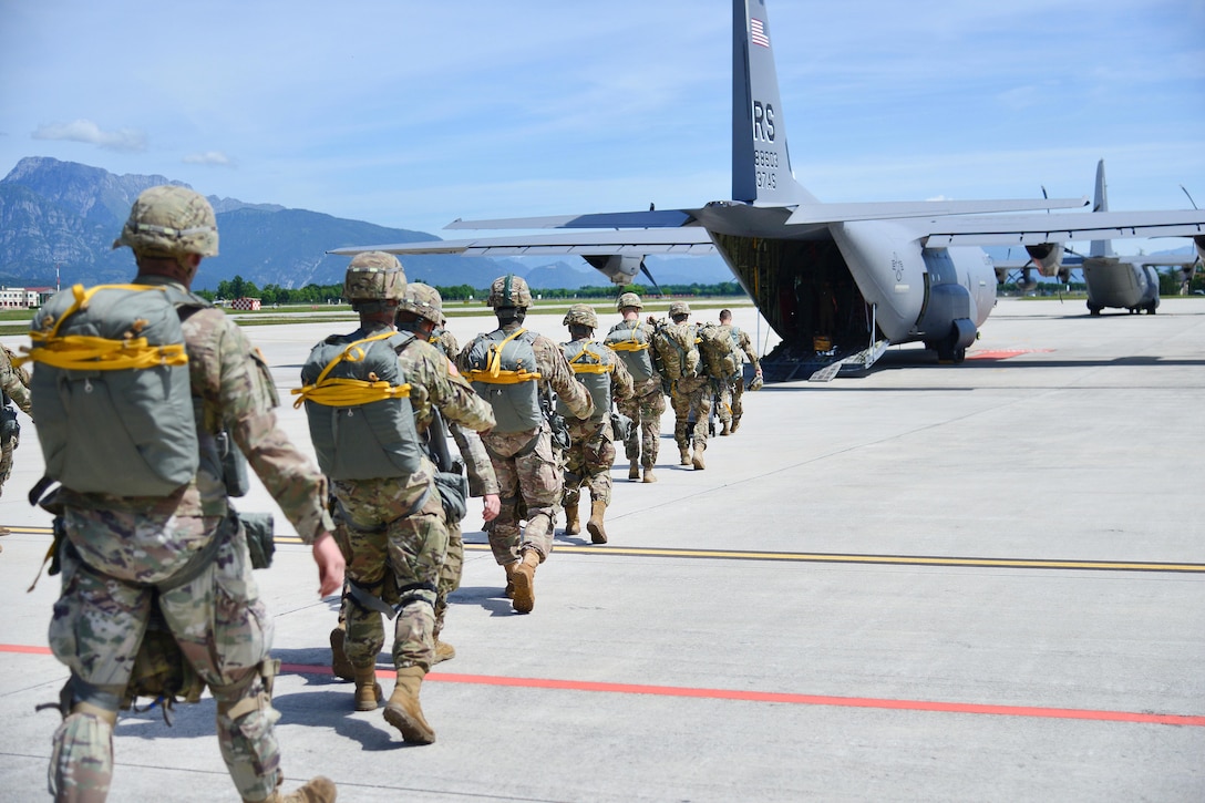 Army paratroopers board an Air Force C-130 Hercules at Aviano Air Base, Italy, June 8, 2017, before conducting an airborne operation. The aircraft crew is assigned to the 86th Air Wing. Army photo by Davide Dalla Massara