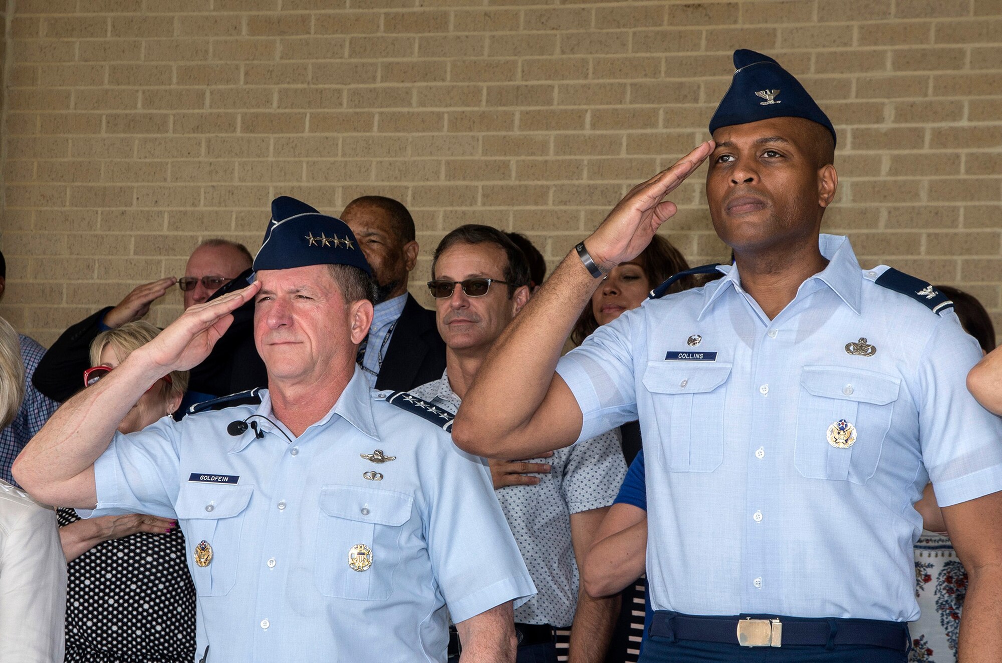Air Force Chief of Staff Gen. David Goldfein and Col. Roy Collins, 37th Training Wing commander, salute during the playing of the national anthem as part of a basic military training graduation June 16, 2017, at Joint Base San Antonio-Lackland. Goldfein toured various JBSA-Lackland facilities and met many 37th Training Wing Airmen during his two-day visit. Every enlisted Airmen begins their Air Force career at basic military training. JBSA-Lackland is often referred to as the "Gateway to the Air Force," graduating about 39,000 Airmen annually. Basic military training is one of the missions of the 37th Training Wing, the largest training wing in the United States Air Force. (U.S. Air Force photo by Johnny Saldivar)