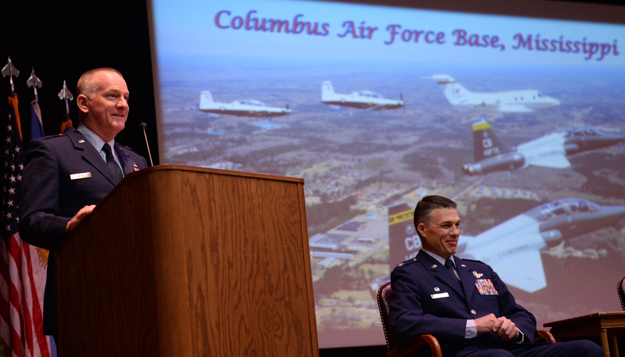 Col. Douglas Gosney, 14th Flying Training Wing Commander, listens as Brig. Gen. Thomas Owens II, Assistant Adjutant General of Air New York National Guard, Latham, New York, speaks for Specialized Undergraduate Pilot Training Class 17-10’s graduation June 9, 2017, on Columbus Air Force Base Mississippi. Owens highlighted the importance of being engaged throughout life and following the core values to become the best Airmen and pilots they can be. Owens reminds Class 17-10 to remain engaged (U.S. Air Force photo by Airman 1st Class Keith Holcomb)

