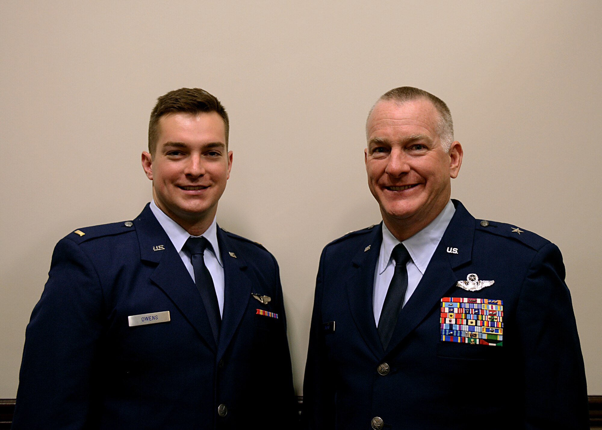 Brig. Gen. Thomas Owens II, Assistant Adjutant General of Air New York National Guard, Latham, New York and his son, 2nd Lt. Thomas Owens III, Specialized Undergraduate Pilot Training Class 17-10 graduate pose for a photo June 9, 2017, on Columbus Air Force Base, Mississippi. Owens III will be the third generation of pilots in a row in the family and his father pinned the pilot wings on him during the ceremony.(U.S. Air Force photo by Airman 1st Class Keith Holcomb)

