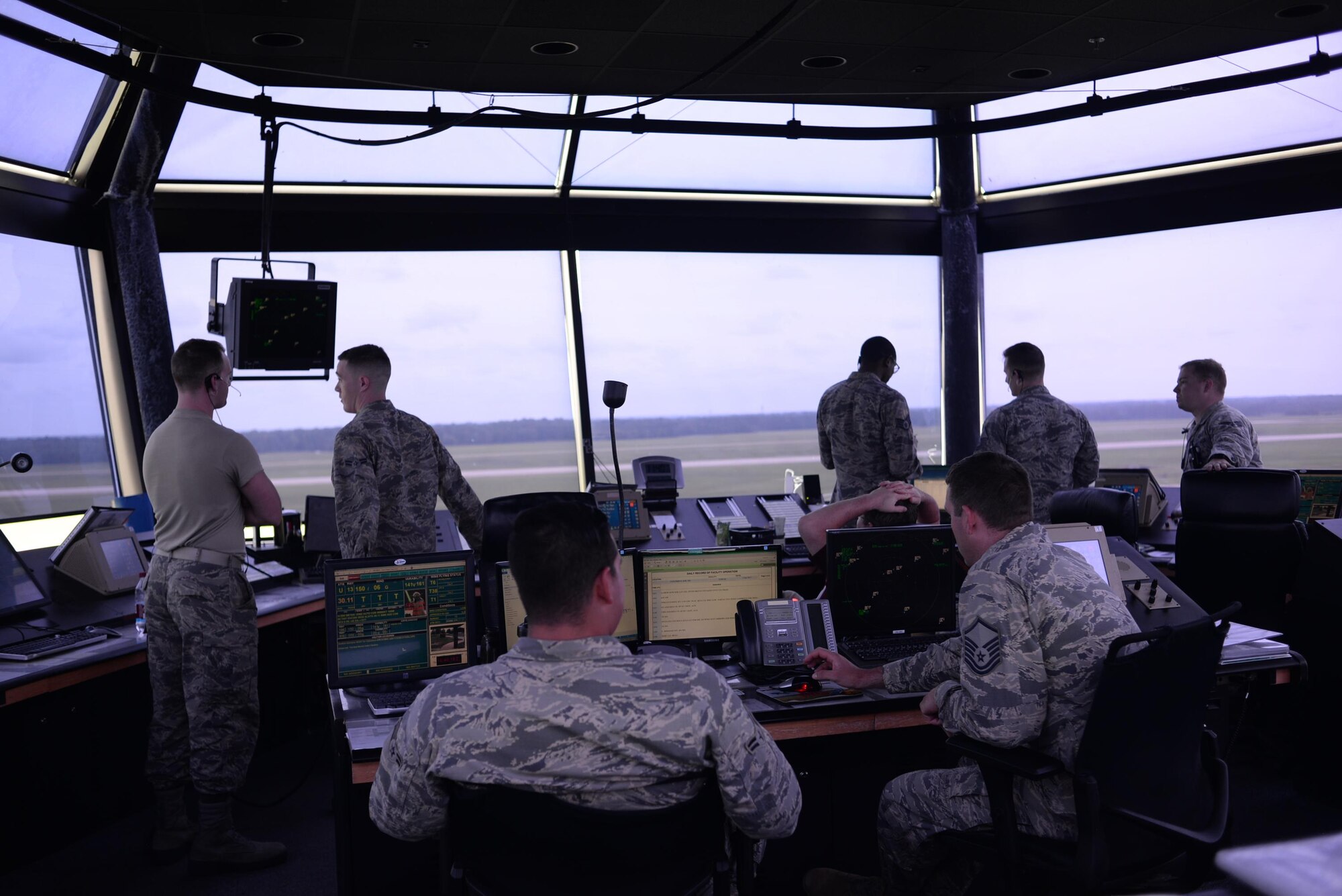 Airmen in the Terminal Radar Control Facility regroup after successfully dealing with an emergency situation May 31, 2017, on Columbus Air Force Base, Mississippi. The TRACON shut down the flightline temporarily to fix an aircraft needing maintenance before it was ready for regular training use. (U.S. Air Force photo by Airman 1st Class Keith Holcomb)

