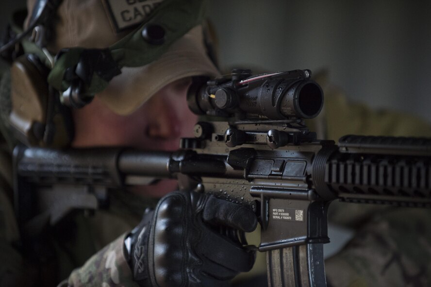 Staff Sgt. Samuel Saintz, 620th Ground Combat Training Squadron formal training instructor, surveys his area of responsibility for combatants during the 2017 Global Strike Challenge at Camp Guernsey, Wyo., May 18, 2017. The 620th GCTS instructors placed the teams of defenders in real world scenarios to test their capabilities and knowledge in combat. (U.S. Air Force photo by Staff Sgt. Christopher Ruano)