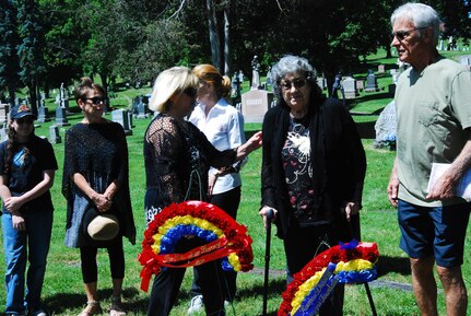 Laura Hegeman, niece of WWII casualty Pfc. Silvio Campanella, assists Campanella’s surviving sister, Yolanda Campanella Robilotto and other family members to view the memorial wreaths and newly placed headstone at the rededication ceremony of Campanella’s graveside at the St. Agnes Cemetery in Albany, N.Y. June 14, 2017. The Rainbow Division Veterans Foundation helped coordinate the memorial ceremony and Soldiers of the 42nd Infantry Division Headquarters provided colors and honors. U.S. National Guard photo by Col. Richard Goldenberg.