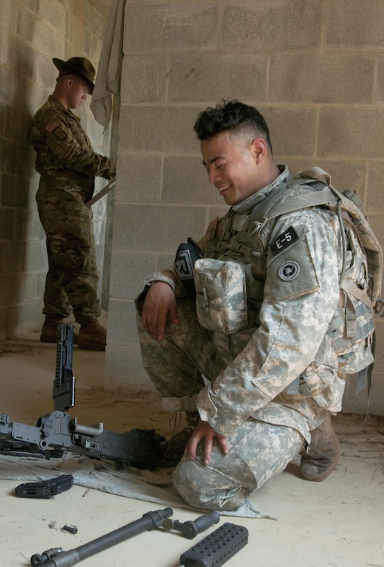 Spc. Kenny Ochoa, an Army Reserve watercraft operator from Chatsworth, Calif., representing the 79th Sustainment Support Command, disassembles an automatic weapon at the 2017 U.S. Army Reserve Best Warrior Competition at Fort Bragg, N.C. June 14. This year’s Best Warrior Competition will determine the top noncommissioned officer and junior enlisted Soldier who will represent the U.S. Army Reserve in the Department of the Army Best Warrior Competition later this year at Fort A.P. Hill, Va. (U.S. Army Reserve photo by SGT David Turner) (Released)