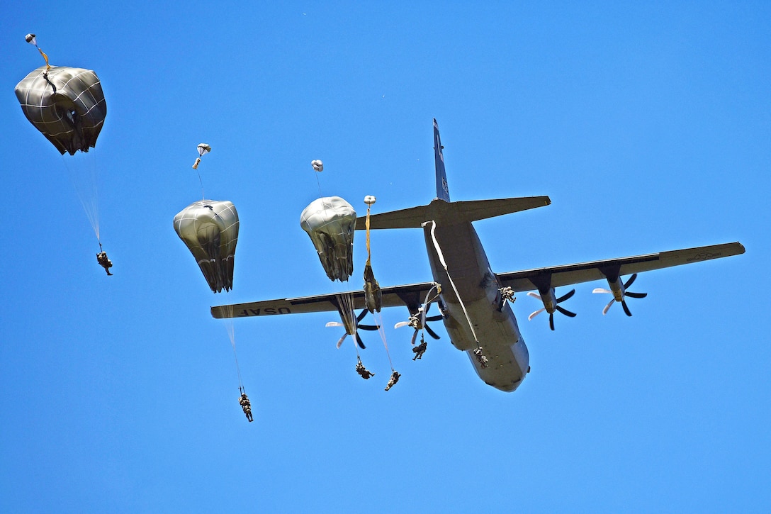 Army paratroopers jump from an Air Force C-130 Hercules over the Juliet drop zone in Pordenone, Italy, June 8, 2017. The soldiers are assigned to the 2nd Battalion, 503rd Infantry Regiment. Army photo by Davide Dalla Massara