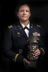 Chief Warrant Officer 2 Jennifer Pace poses for a portrait in Baltimore, Maryland, June 15, where she used to work as a police officer before committing her career full time to the U.S. Army Reserve. Pace is among this year's recipients of the General Douglas MacArthur Leadership Award, which she won as a property book officer while working for the 290th Military Police Brigade, headquartered in Nashville, Tennessee. In her leadership journey and professional growth, Pace overcame the loss of her brother, Danny Gamez, who passed away in 2011. (U.S. Army Reserve photo by Master Sgt. Michel Sauret)