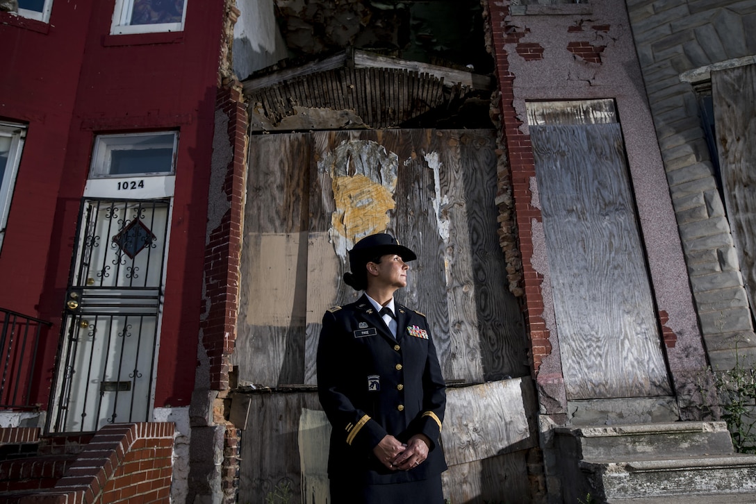 Chief Warrant Officer 2 Jennifer Pace poses for a portrait in West Baltimore, Maryland, June 15, where she used to work as a police officer before committing her career full time to the U.S. Army Reserve. Pace is among this year's recipients of the General Douglas MacArthur Leadership Award, which she won as a property book officer while working for the 290th Military Police Brigade, headquartered in Nashville, Tennessee. In her leadership journey and professional growth, Pace overcame the loss of her brother, Danny Gamez, who passed away in 2011. (U.S. Army Reserve photo by Master Sgt. Michel Sauret)