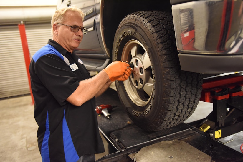 Chuck Baumbach, Auto Skills Center assistant manager, tightens the lug nuts on a customer’s vehicle in the ASC at Joint Base Charleston, S.C. June 15, 2017. The ASC has 12 bays, nine with lifts, two flat bays and one motorcycle bay. Their rates are $5 per hour for the flat bays and $8 per hour for the lift bays.