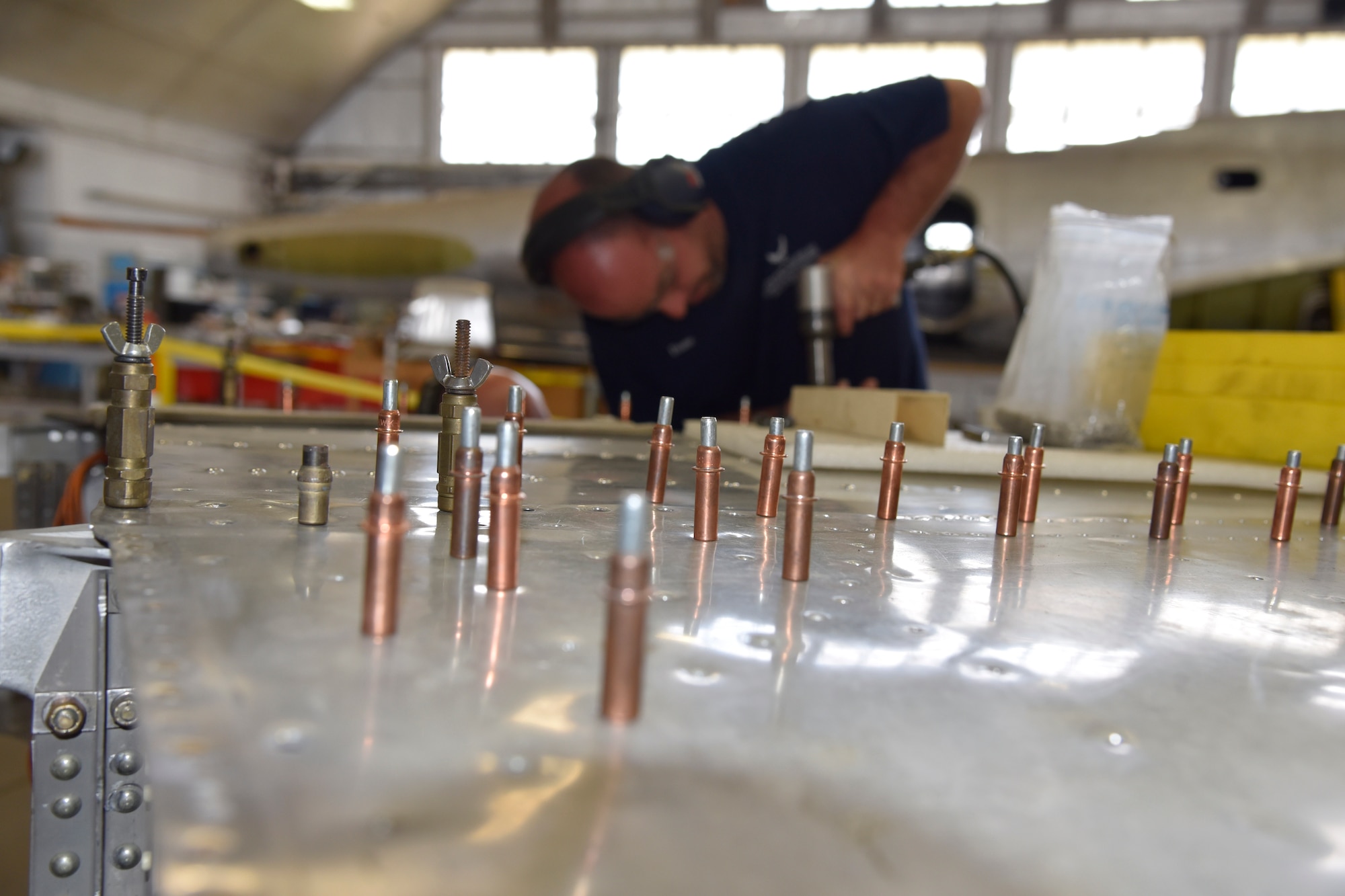 DAYTON, Ohio (06/2017) -- Restoration Specialist Duane Jones works on the B-17F "Memphis Belle"™ in the restoration hangar at the National Museum of the U.S. Air Force. The exhibit opening for this aircraft is planned for May 17, 2018.(U.S. Air Force photo by Ken LaRock)