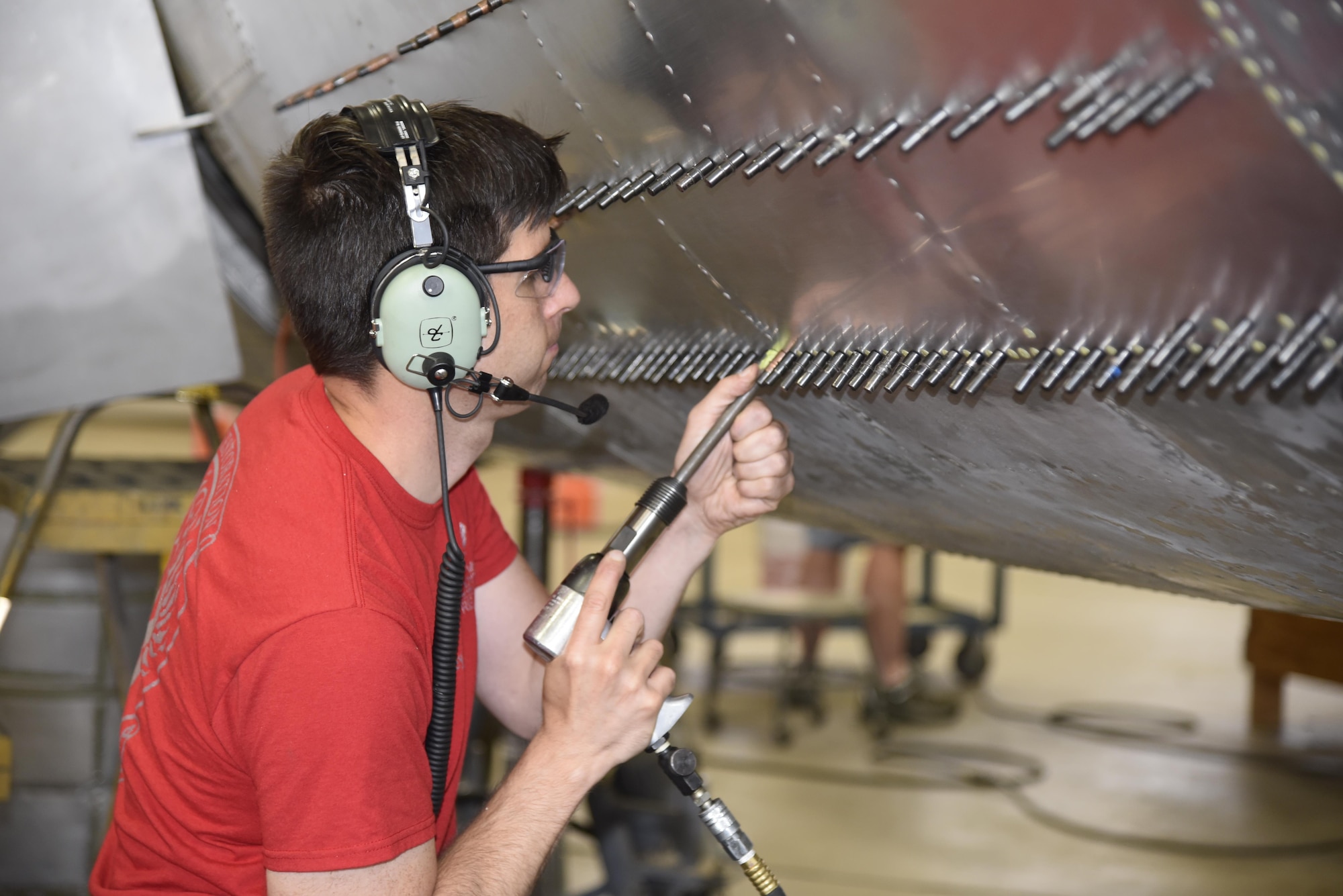 DAYTON, Ohio (06/2017) -- Restoration specialist Casey Simmons works on the B-17F "Memphis Belle" in the restoration hangar at the National Museum of the U.S. Air Force. The exhibit opening for this aircraft is planned for May 17, 2018.(U.S. Air Force photo by Ken LaRock)